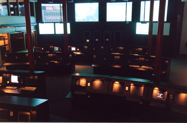 Fiber Network Solutions Network Operations Center (NOC) in Columbus, Ohio, featuring a mission-control-style operations floor with network monitoring consoles and wall displays supporting the company's Tier-One Internet backbone under the leadership of President and CEO David J. Koch.