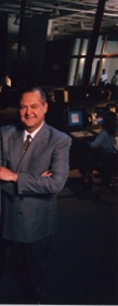 David J. Koch standing in the Fiber Network Solutions Network Operations Center as President, CEO, and Chairman of FNSI, illustrating executive leadership, entrepreneurship, rehabilitation, and successful prisoner reentry after building a Tier-One Internet provider.