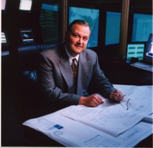 David J. Koch serving as President, CEO, and Chairman of Fiber Network Solutions, reviewing data center expansion plans, illustrating successful prisoner reentry, rehabilitation, entrepreneurship, and executive leadership after a felony conviction.